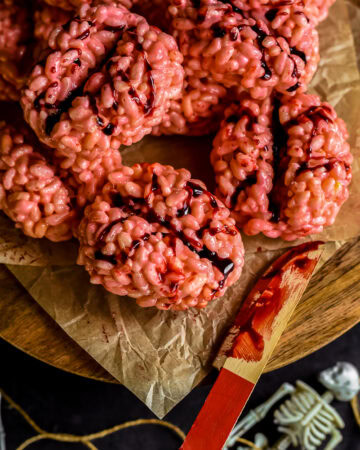 Close up of brain rice krispies with a bloody knofe.