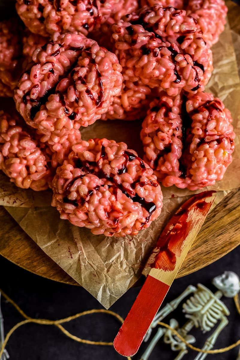 Close up of brain rice krispies with a bloody knofe.